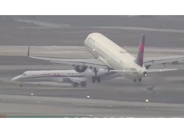 A plane from a commercial airline almost collides with a sports team's aircraft.