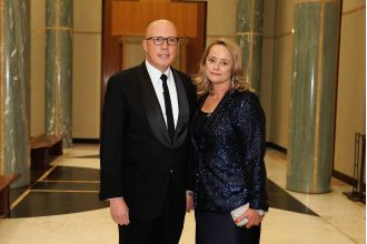 PM demands removal of offensive social media post targeting Dutton and his spouse.