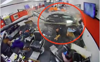 A 10-year-old boy was injured when an SUV drove into a barber shop.