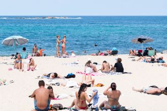 Australia has a mix of sunny and stormy weather while many people take advantage of a holiday.