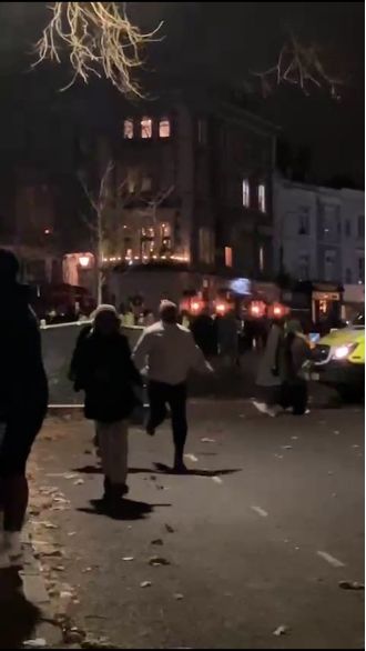 A man was taken into custody after his car veered into a group of people who were ringing in the New Year.
