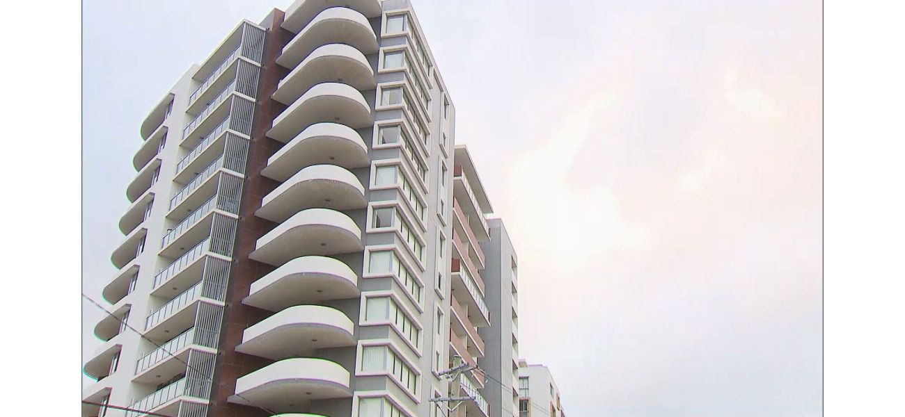A man was taken into police custody following a woman's death from falling off a high-rise apartment.