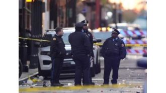 A driver intentionally crashes into New Year's celebrators in New Orleans, causing 10 deaths. FBI looking into possibility of terrorism.