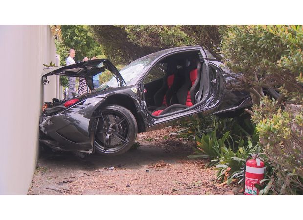Ferrari smashes into house in Sydney's harbourside neighborhood.