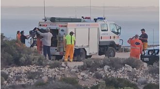 Search for person attacked by shark will restart after sunset.
