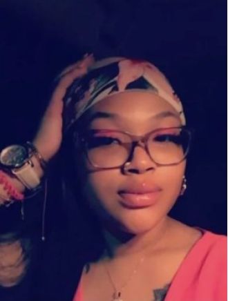 Missing woman's body discovered on family's front lawn.