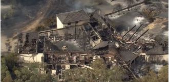 Perth bushfires destroy home while owners are away.