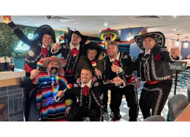 Bournemouth fans praised for aiding homeless man at darts event.