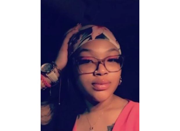 Missing woman's body discovered on family's front lawn.