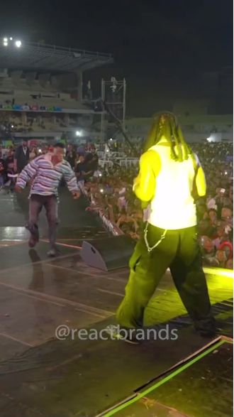 Famous rapper surprised by fan who crashed stage and caused him to end show.