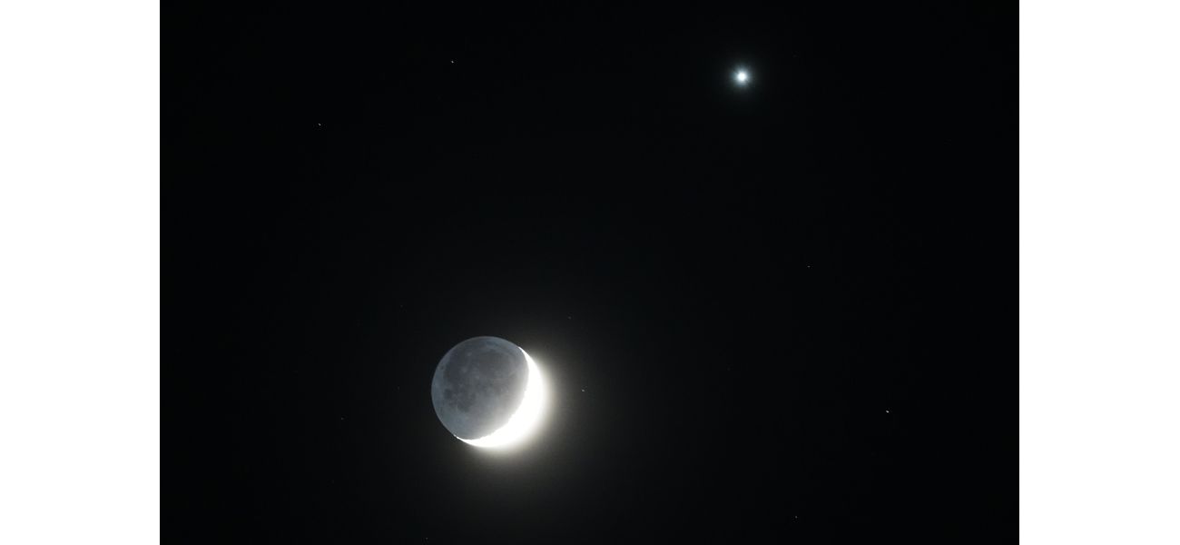 The Moon's crescent shape is illuminated by the bright light of Venus.