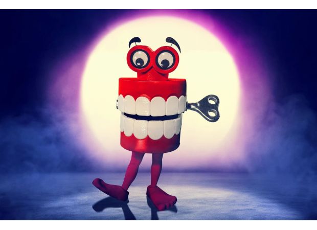 Is The Masked Singer's Teeth a comedian or a football hero? Fans speculate and share their theories.