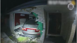 Family narrowly avoids disaster as car crashes into bedroom.