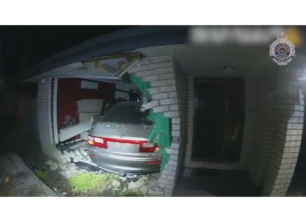 Family narrowly avoids disaster as car crashes into bedroom.