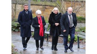 David Beckham attends funeral of Manchester United legend with a serious expression.