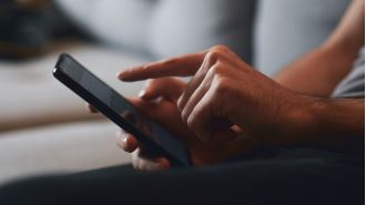 A teacher was prohibited from teaching after illegally accessing a coworker's phone to send a personal video to his own device.