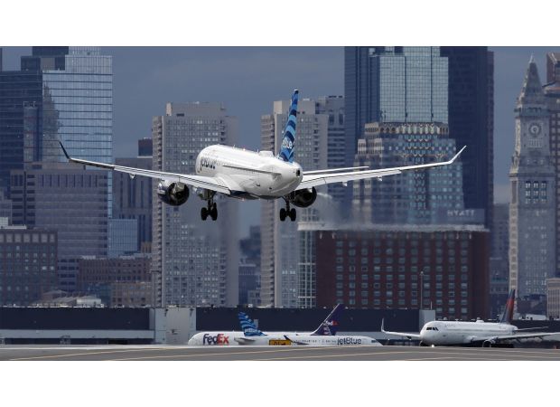Passenger opens exit door as plane prepares to take off.
