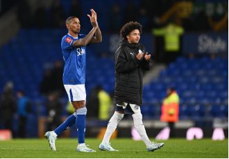 Darren Ferguson criticized for not letting Ashley Young's son play and missing chance to make history against Everton.