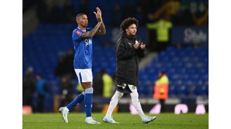 Darren Ferguson criticized for not letting Ashley Young's son play and missing chance to make history against Everton.
