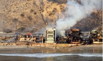 Amazing Malibu house miraculously spared from destructive wildfires that destroyed surrounding area.