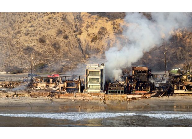 Amazing Malibu house miraculously spared from destructive wildfires that destroyed surrounding area.