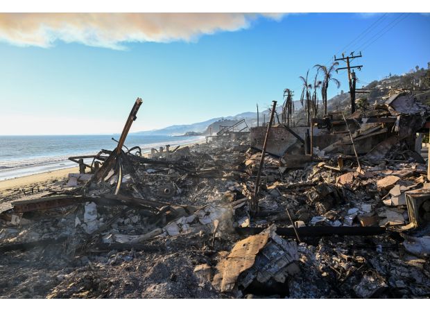 Thieves disguised as firefighters add to the nightmare of LA wildfires, with rising death toll.