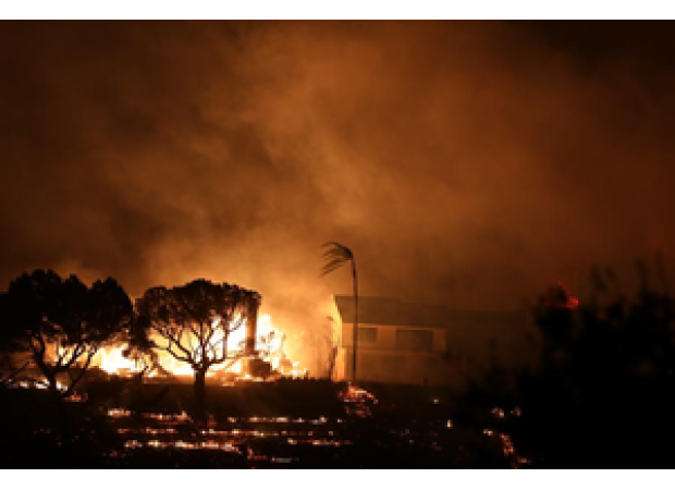 Crews battle strong winds to protect homes and landmarks as death toll increases in Los Angeles wildfires.