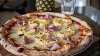 A restaurant hates making pineapple pizzas so they charge £100 for it.