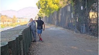 Man prevented from setting fire to dead leaves in LA after recent deadly wildfires.