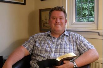 A vicar was reprimanded for not leaving when he accidentally saw a parishioner in the shower.