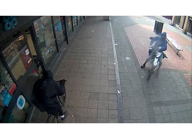 Teenage gunmen on a bike shot and injured another cyclist at close range, causing a shocking incident.