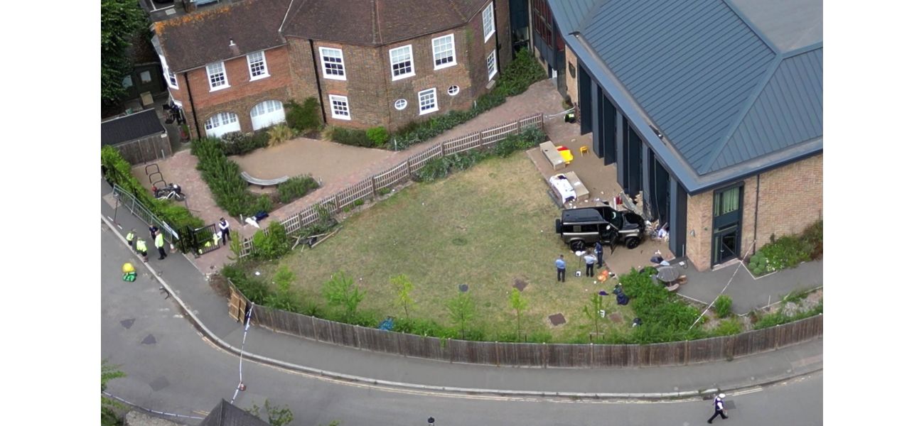 A woman was arrested again for driving into a school and causing the death of two eight-year-old girls.