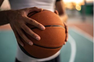 A high school student is accused of attacking another player for using a racial slur during a game.