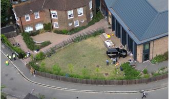 A woman was arrested again for driving into a school and causing the death of two eight-year-old girls.
