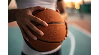 A high school student is accused of attacking another player for using a racial slur during a game.