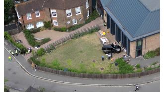 A woman was arrested again for driving into a school and causing the death of two eight-year-old girls.