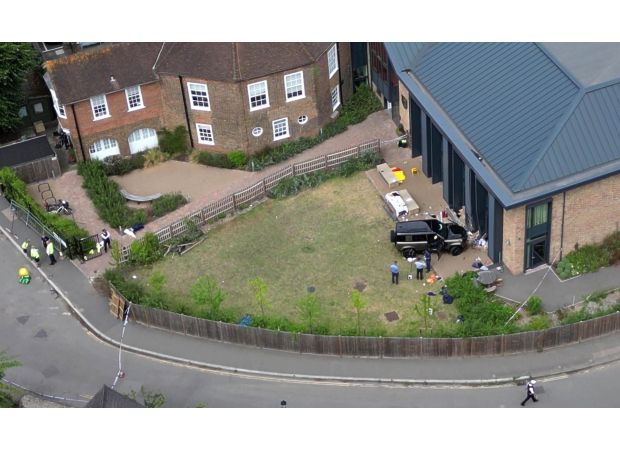 A woman was arrested again for driving into a school and causing the death of two eight-year-old girls.