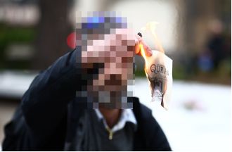 Man taken into custody for burning pages of Koran during memorial for victims of terrorist attack.