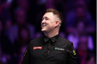 Kyren Wilson beats Barry Hawkins in thrilling German Masters final.
