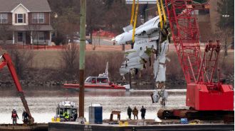 A crane lifted the crashed American Airlines plane from the river.