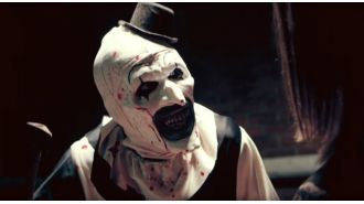 Filmmaker criticized for not incorporating political themes into violent horror series.