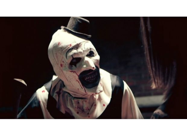 Filmmaker criticized for not incorporating political themes into violent horror series.