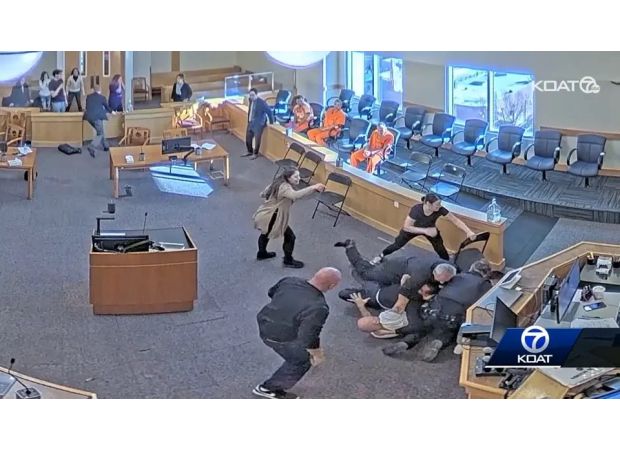 Woman's relative attacks killer and wins during colossal courtroom fight.