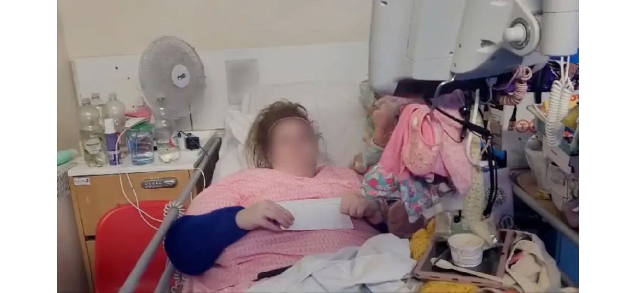A woman was arrested and forced to leave after living in a hospital bed for 18 months.