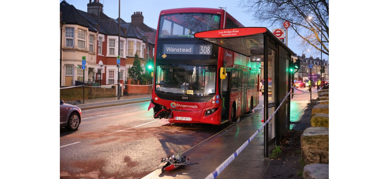 A woman died in a collision with a double decker bus in east London.