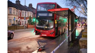 A woman died in a collision with a double decker bus in east London.
