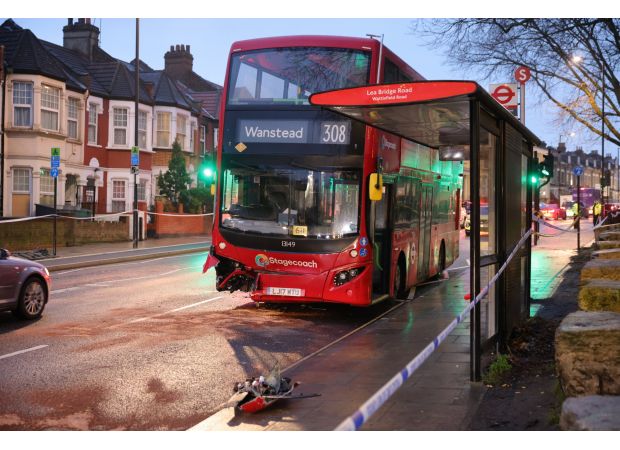 A woman died in a collision with a double decker bus in east London.