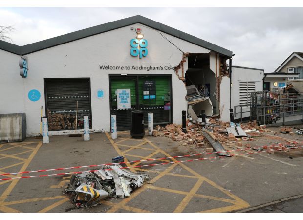 Forklift used to steal cash machine from Co-op store by thieves.