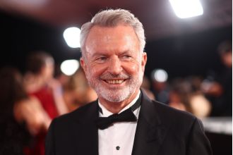 Actor Sam Neill remains positive and upbeat despite undergoing treatment for blood cancer, as seen during a recent public event.