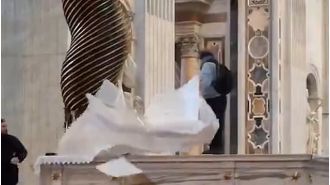 Masked vandal disrupts Catholic pilgrimage by desecrating Vatican altar.